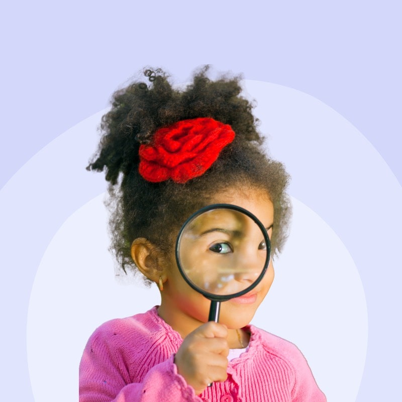 A curious child exploring with a magnifying glass