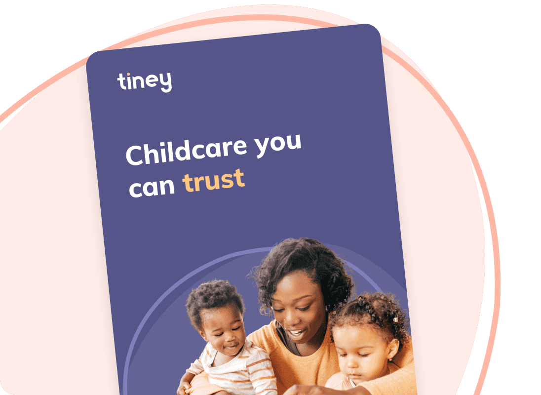 Book with childminder and children building blocks